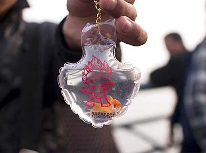 Live goldfish inside unofficial Olympic keychains +