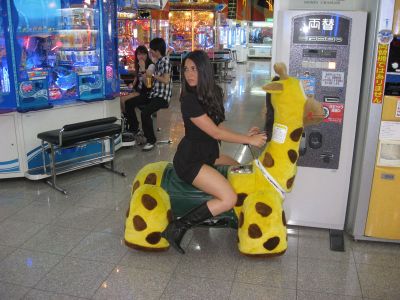Olivia Munn on a giraffe